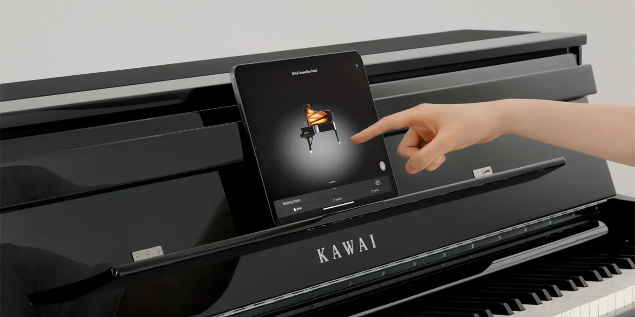 Kawai CA 901 touch display being operated by hand