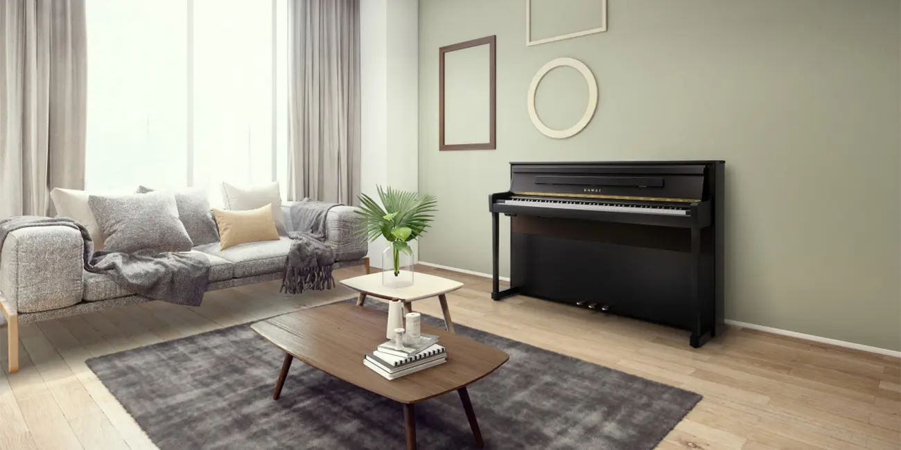 Kawai CA 901 digital piano in a light finish in a living room