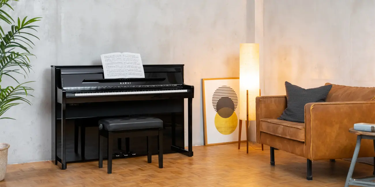Kawai CA 901 digital piano with sheet music in a living room