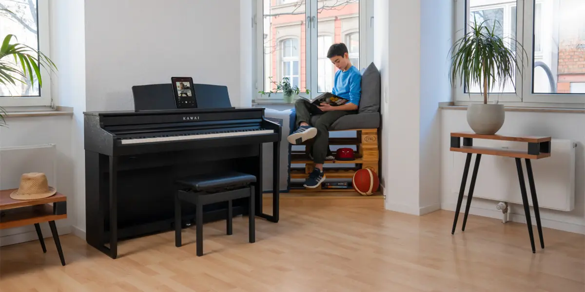 Kawai CA 401 digital piano in a living room with a person in the background