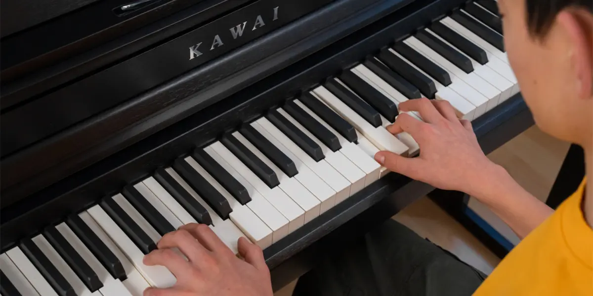 Kawai CA 401 keyboard being played with both hands