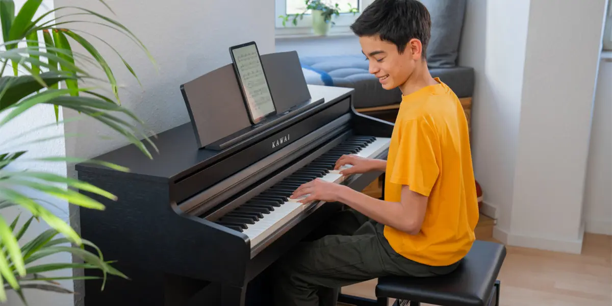 Kawai CA 401 digital piano being played by a person in a living room