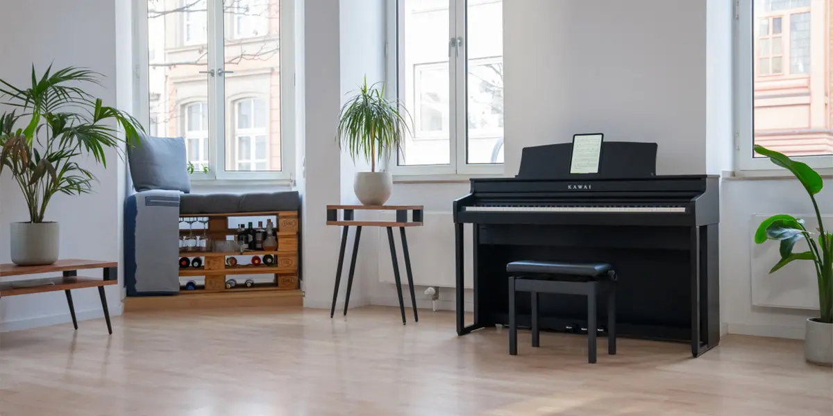 Kawai CA 401 digital piano in black in a bright living room with piano bench