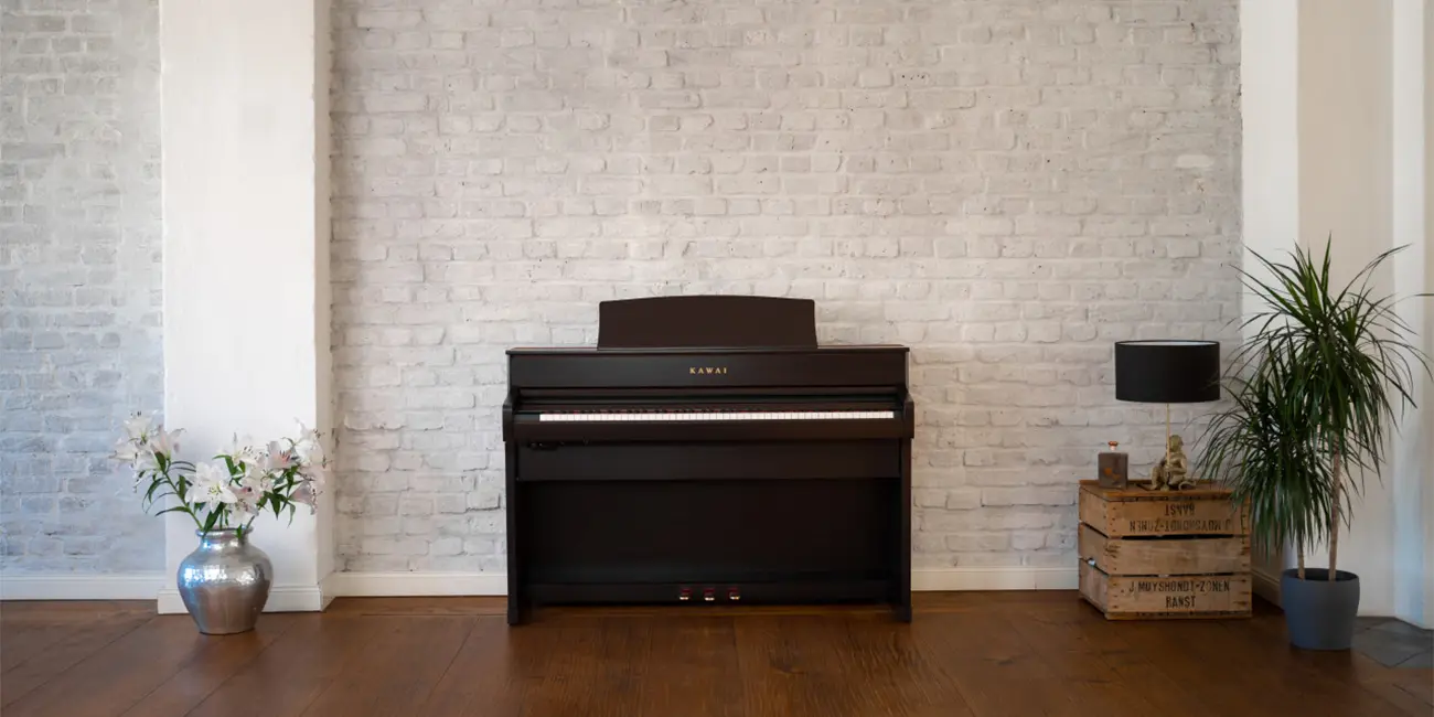 Kawai CA 701 digital piano in a dark wood finish in the living room