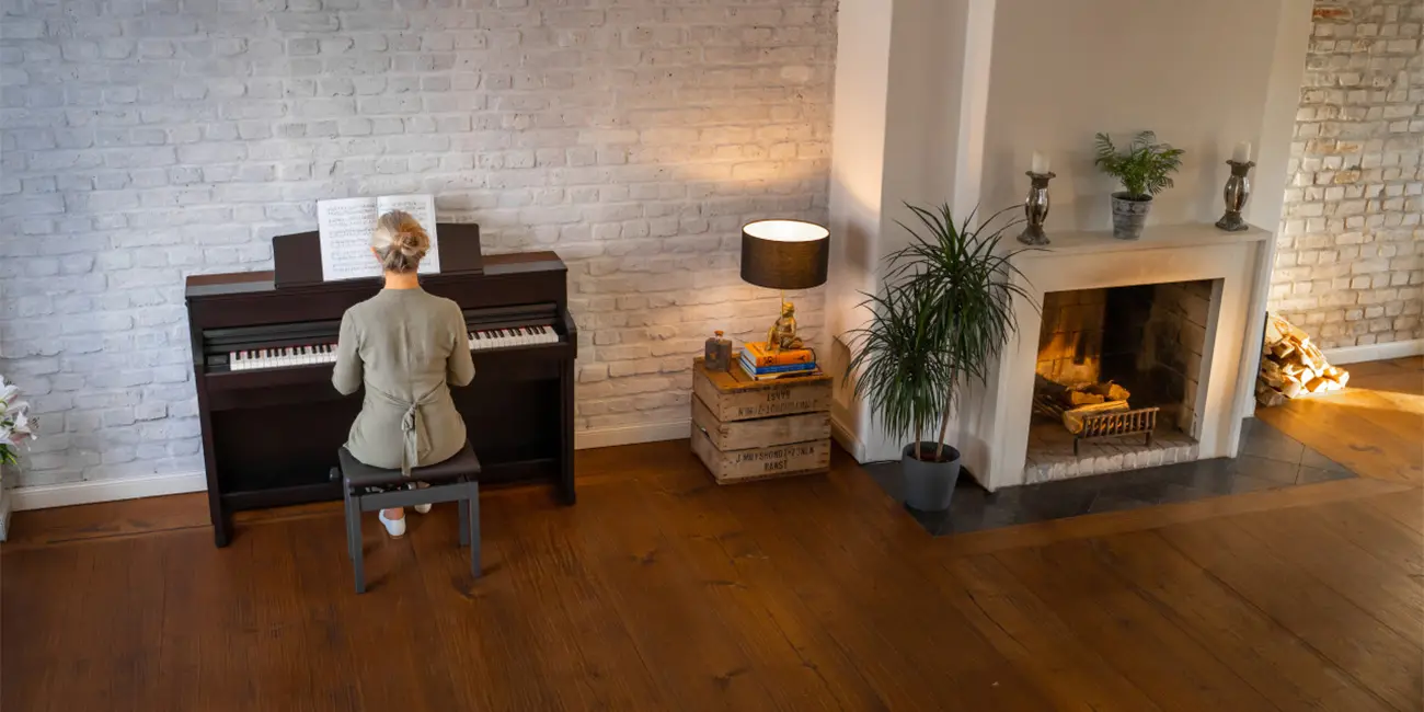Kawai CA 701 digital piano with a child in the living room