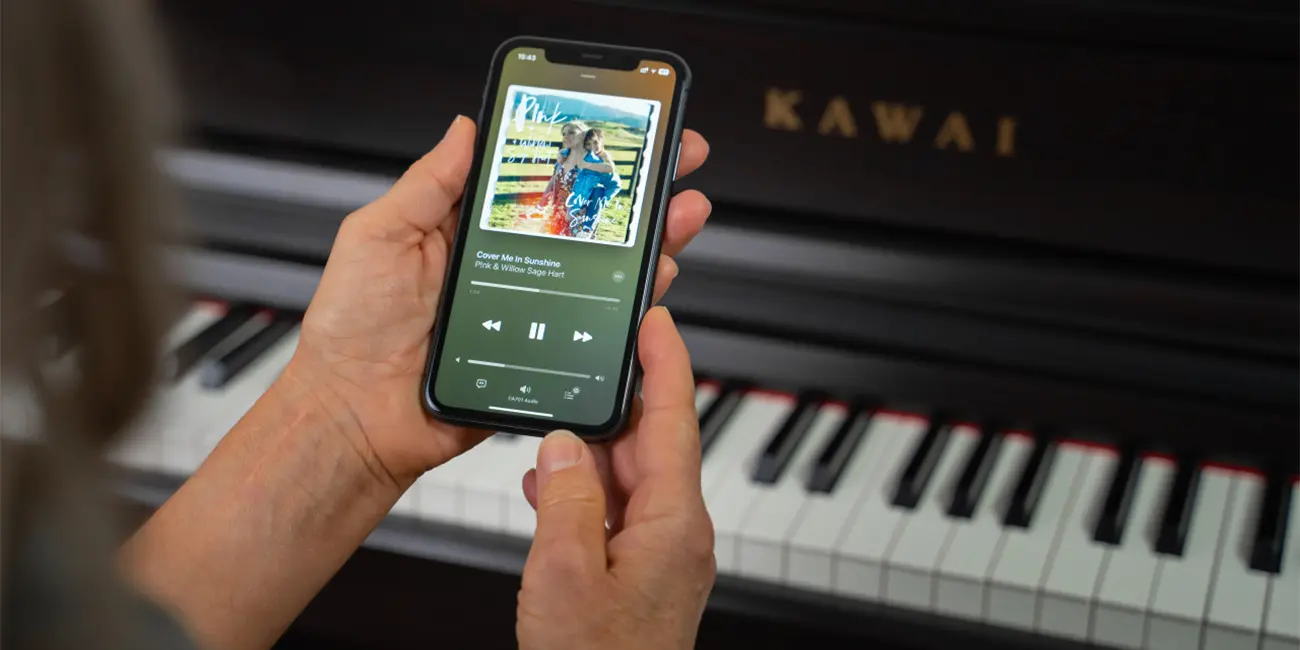 Kawai CA 701 with smartphone app in front of the digital piano