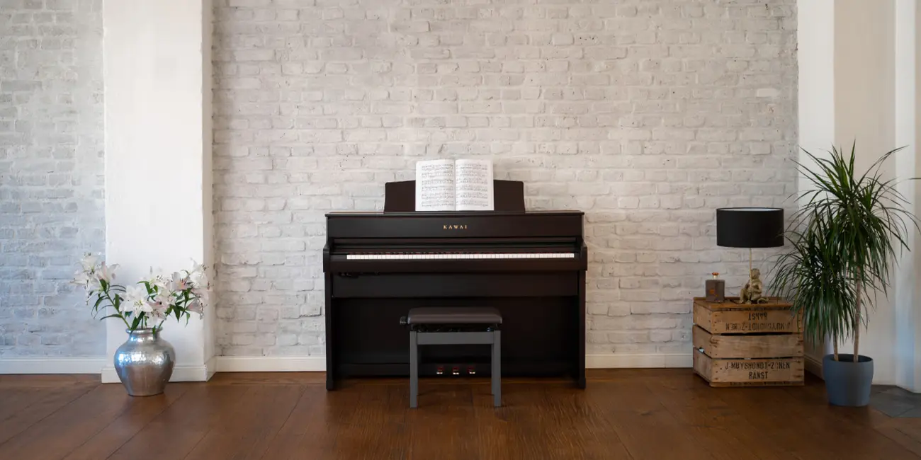 Kawai CA 701 digital piano with sheet music in a living room