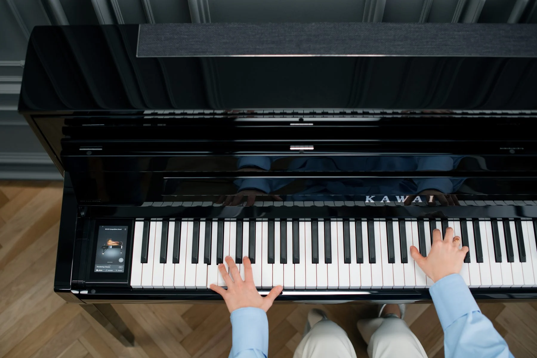 Hands playing a Kawai NOVUS NV6 seen from above with the top speakers