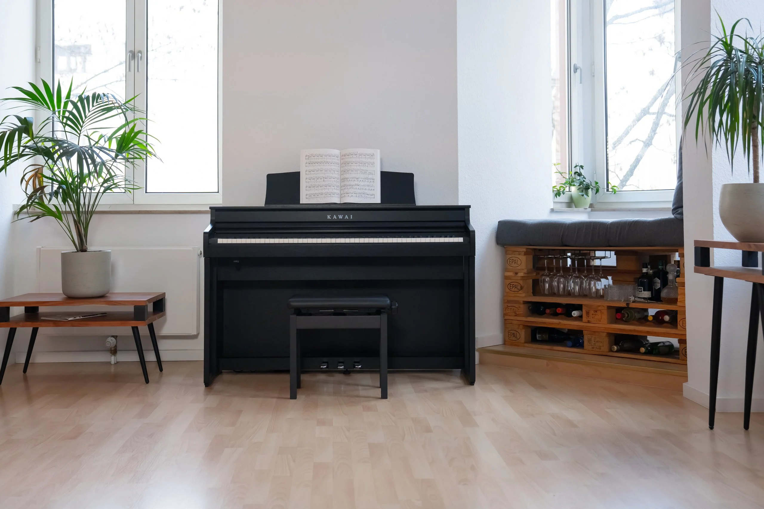 Kawai CA 401 digital piano in Premium Satin Black in a bright living room